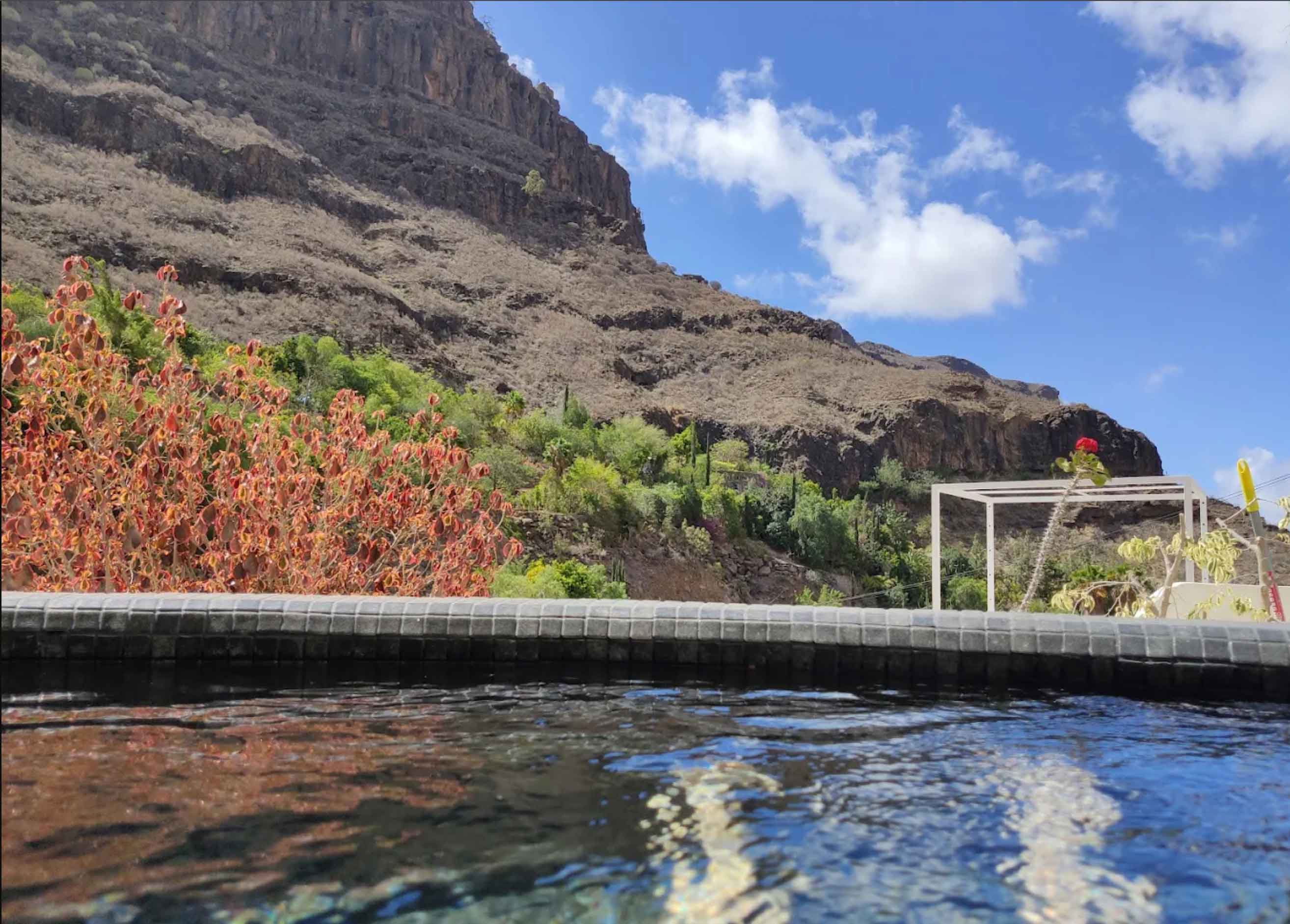 The jacuzzi and volcanic mountain view at Aya House
