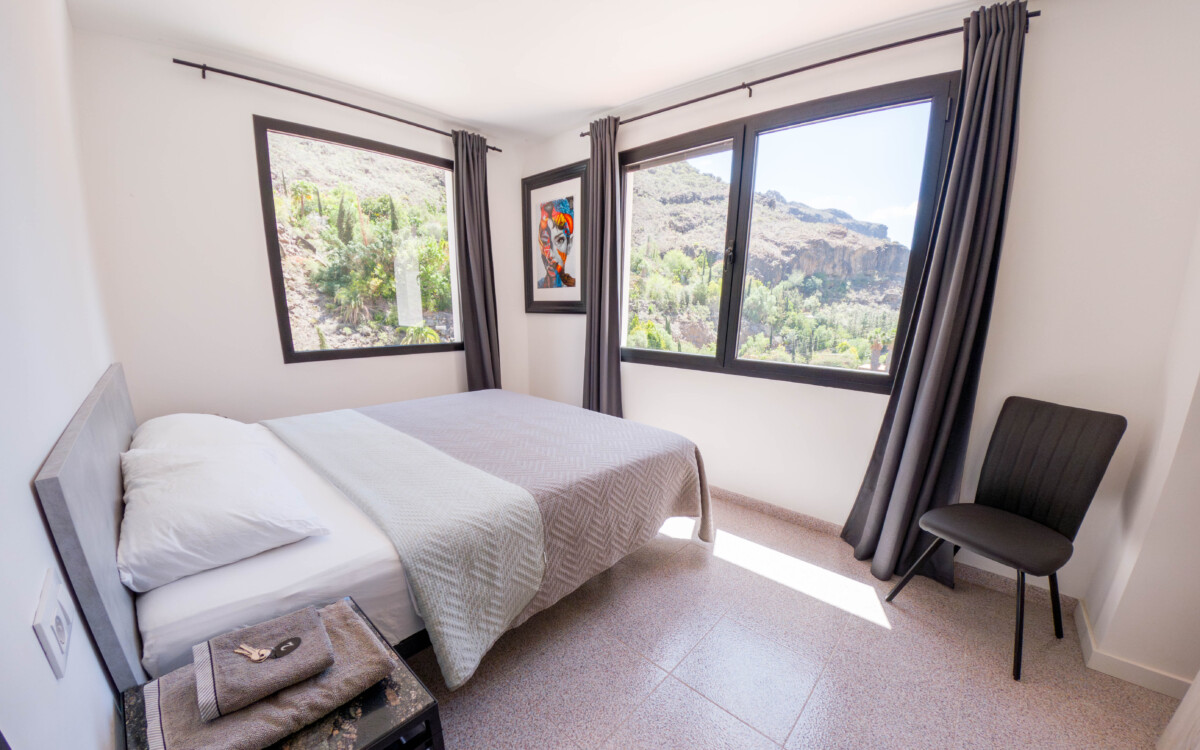 A peaceful private bedroom at Aya House
